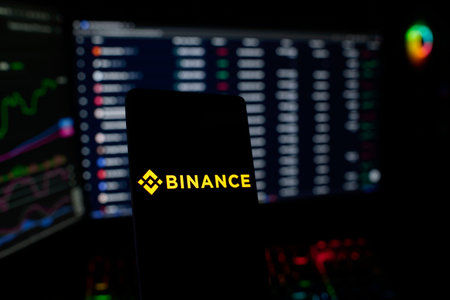 Binance logo displayed on smartphone screen. Binance is a stock exchange in Thailand.