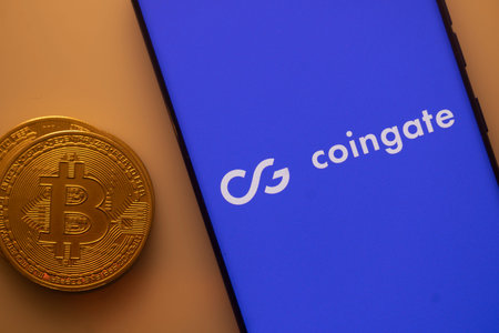 Dhaka, Bangladesh 22 September 2025:Bitcoin and Coingate logo on a blue smartphone screen set...