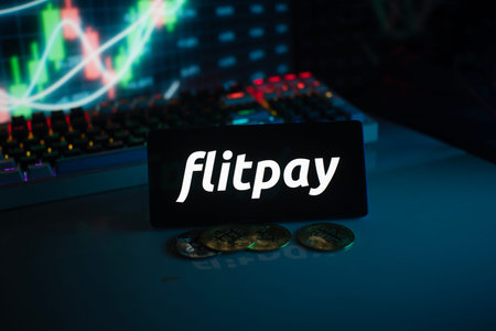 Dhaka, Bangladesh 18 September 2025: Flitpay logo in a dark setting with coins and a glowing financial chartのeditorial素材