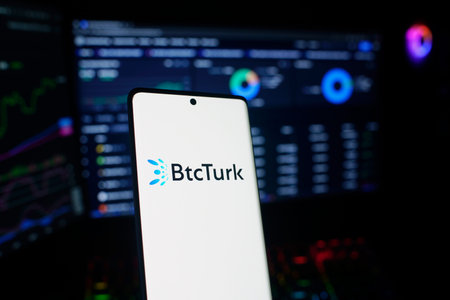 Dhaka, Bangladesh 04 Jan 2026: Smartphone displaying BtcTurk logo surrounded by Bitcoin coins and...
