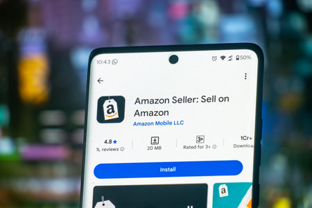 Dhaka, Bangladesh 22 Dec 2025:Amazon Logo On Mobile And Computer Screens With Stock Chart Backgroundのeditorial素材