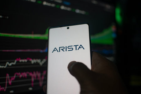 Dhaka, Bangladesh 20 Feb 2026:Smartphone with Arista logo, stock market data visible in the backgroundのeditorial素材