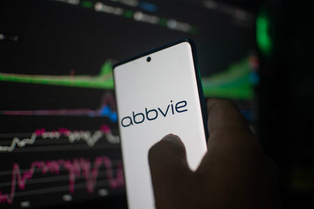 Dhaka, Bangladesh 20 Feb 2026:A smartphone displays Abbvie against a backdrop of stock market...