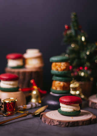 Macaroons and christmas tree on wooden background. Selective focus.の写真素材