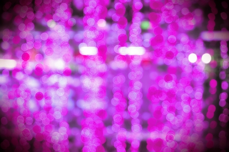 Soft pink circular bokeh abstract background with vignette border.の写真素材