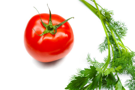 Tomato and herbs isolated on white background