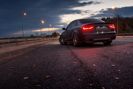 Car stay near a road at night in the cityのeditorial素材