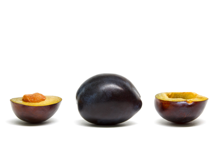Plum Damson cut isolated on white backgroundの写真素材