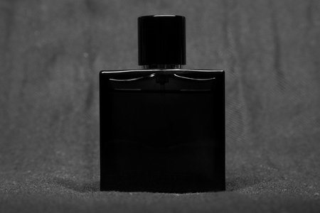 Bottle of men perfume and gray scarfの写真素材