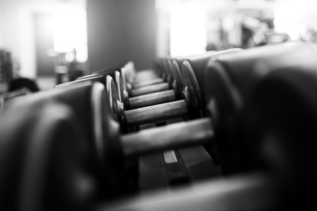 Metal dumbbells lying on gym fitness clubの写真素材