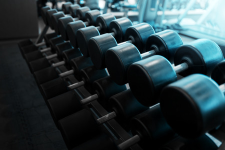 Metal dumbbells lying on gym fitness clubの写真素材