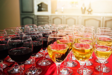 Red and white wine on banquet tableの写真素材