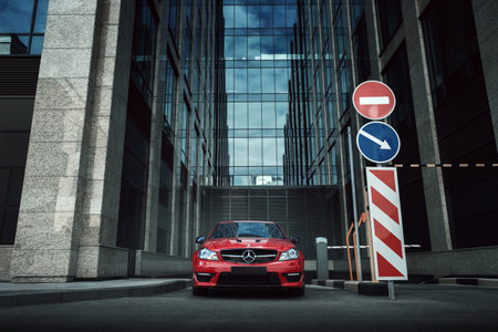 Moscow, Russia - July 10, 2016: Red car Mercedes-Benz C63 AMG stay on asphalt road in the city...