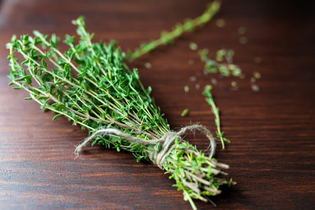 Fresh green bunch of thyme on wooden backgroundの写真素材