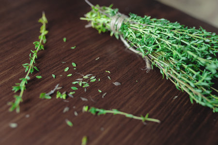 Fresh green bunch of thyme on wooden backgroundの写真素材