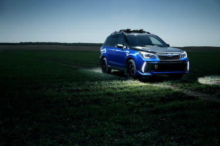 Saratov, Russia - September 28, 2015: Car Subaru Forester stand at countryside off-road on green field at nightのeditorial素材