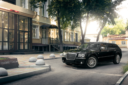 Saratov, Russia - August 9, 2015: Black car Chrysler 300c standing on asphalt road in the city at daytimeのeditorial素材