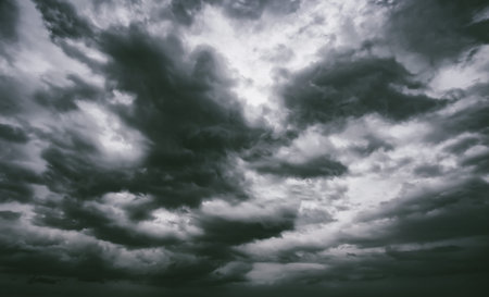 Dramatic thunderstorm clouds background at dark sky