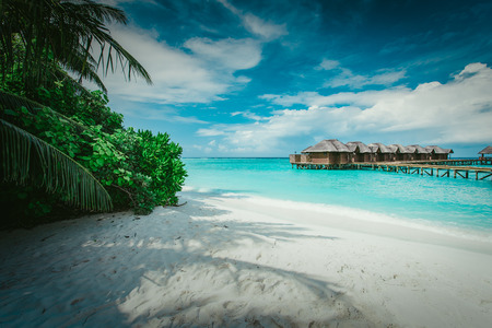 Water bungalows resort at islands. Indian Ocean, Maldivesの写真素材