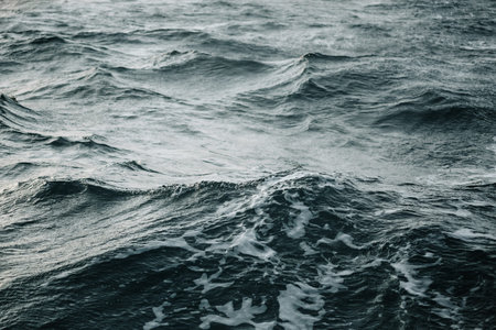 Abstract water texture background. Sun reflected on water
