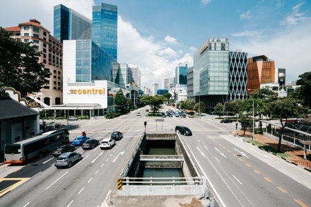 Singapore, Singapore - October 15, 2017: Central street in downtown district at Singapore city at sunny day. Cars is drive on the roadのeditorial素材