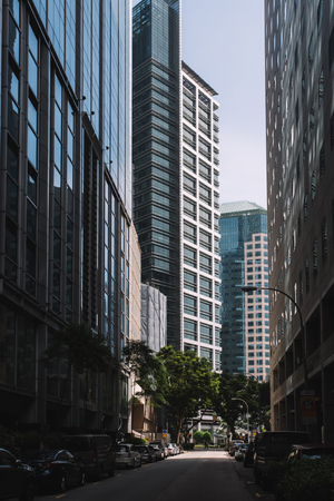 Singapore, Singapore - October 15, 2017: Central street in downtown district at Singapore city at sunny day. Cars on the roadのeditorial素材