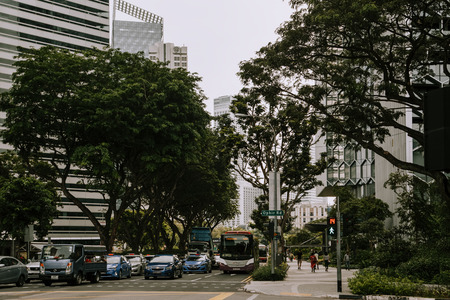 Singapore, Singapore - October 14, 2017: Central street in downtown district at Singapore city at sunny day. Cars on the roadのeditorial素材