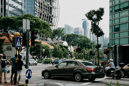 Singapore, Singapore - October 14, 2017: Central street in downtown district at Singapore city at sunny day. Cars on the roadのeditorial素材