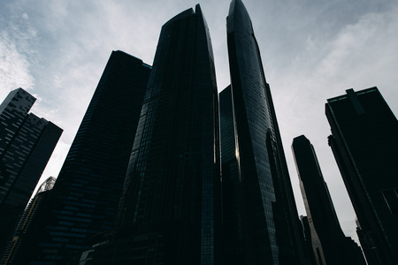Bottom view to modern skyscrapers at downtown district. Business landscape background. Singapore cityの写真素材