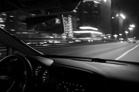 Car speed drive on the road in night cityの写真素材