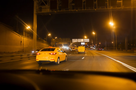 Car speed drive on the road in night Moscow cityの写真素材