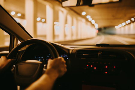 Car speed drive on the road in night cityの写真素材