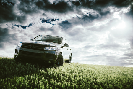 Saratov, Russia - June 07, 2018: Black car Volkswagen Touareg is parked at countryside off-road at daytimeのeditorial素材
