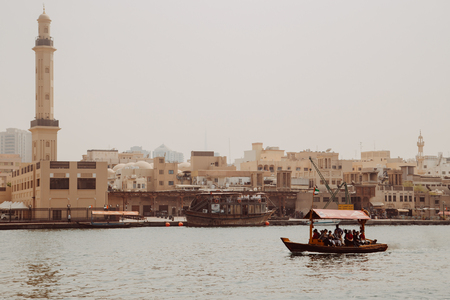 Dubai, UAE - September 09, 2018: Excursion boats with tourists on the Dubai Creek near old town Al Fahidi district Dubai, UAE - September 09, 2018: Excursion touristic boats with tourists on the Dubai Creek near old town Al Fahidi districtのeditorial素材
