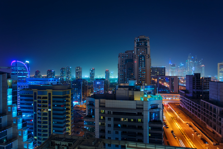 Beautiful view to Dubai, United Arab Emirates. City skyline. Long exposure time lapse effect at nightの写真素材