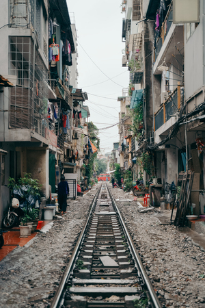 Hanoi Train Street. Vietnam city railway at rainy day. Famous tourist destinationの写真素材