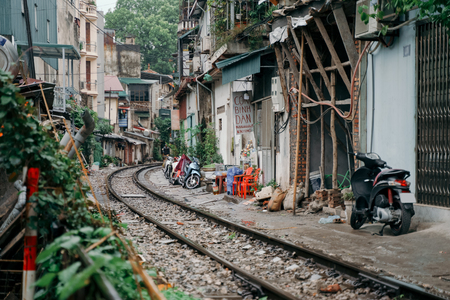 Hanoi Train Street. Vietnam city railway at rainy day. Famous tourist destinationのeditorial素材