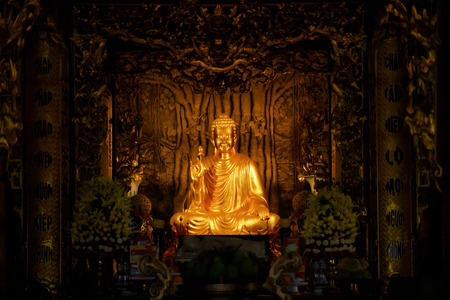 Vietnam travel. Ho Quoc Pagoda at Phu Quoc Island. Golden Buddha statue inside of templeのeditorial素材