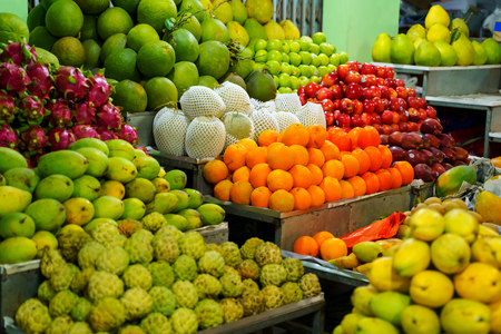 Fresh fruits for sale at night market in Vietnam. Exotic tropical foodの写真素材