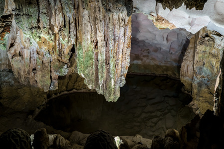 Cave deep dark inside. Underground of stone rock mountain. Ha Long Vietnam nature backgroundの写真素材