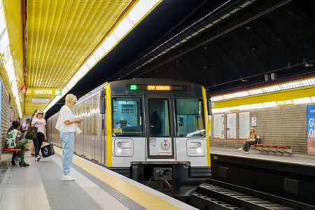 Milan, Italy - June 16, 2019: Train is coming to platform in Affori Centro metro station. People passengers are waiting for arrivingのeditorial素材