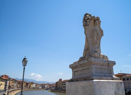 Cityscape view of Arno River in Pisa city old town in a sunny day, Italyの写真素材