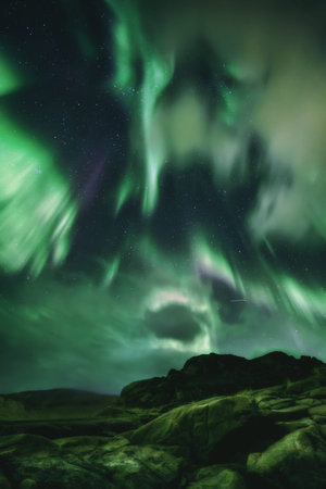 Northern Lights, Aurora Borealis in Kola Peninsula at night sky illuminated green. Murmansk region,...