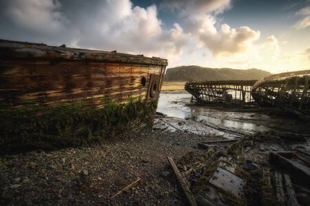 Abandoned ships cemetery at low tide near Teriberka village in Murmansk Region. Kola peninsula, Northern Russiaの写真素材