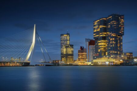 Rotterdam city skyline cityscape, Netherland (Holland) at night. View of downtown and Erasmus bridgeの写真素材