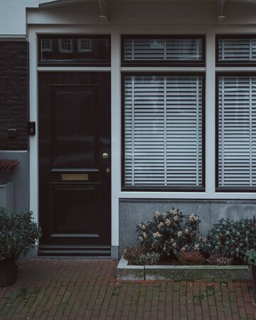 Amsterdam city old town. Traditional house entrance. Netherlands (Holland)の写真素材