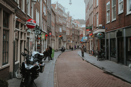 Amsterdam, Netherlands - March 7, 2020: People are walking on the street in Amsterdam city center old townのeditorial素材