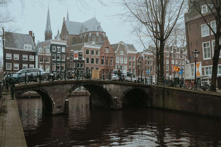 Amsterdam, Netherlands - March 7, 2020: People are walking on the street in Amsterdam city center old townのeditorial素材