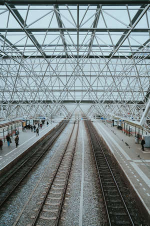 Zaandam, Netherlands - March 6, 2020: People are waiting for the train at Zaandam railway stationのeditorial素材