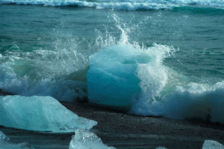 Diamond Beach (Jokulsarlon) landscape in East Iceland. Ice on black volcanic sand in the dayの写真素材
